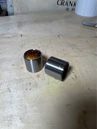 Bạc trục càng cua bi tê, 25x29x27 - cái